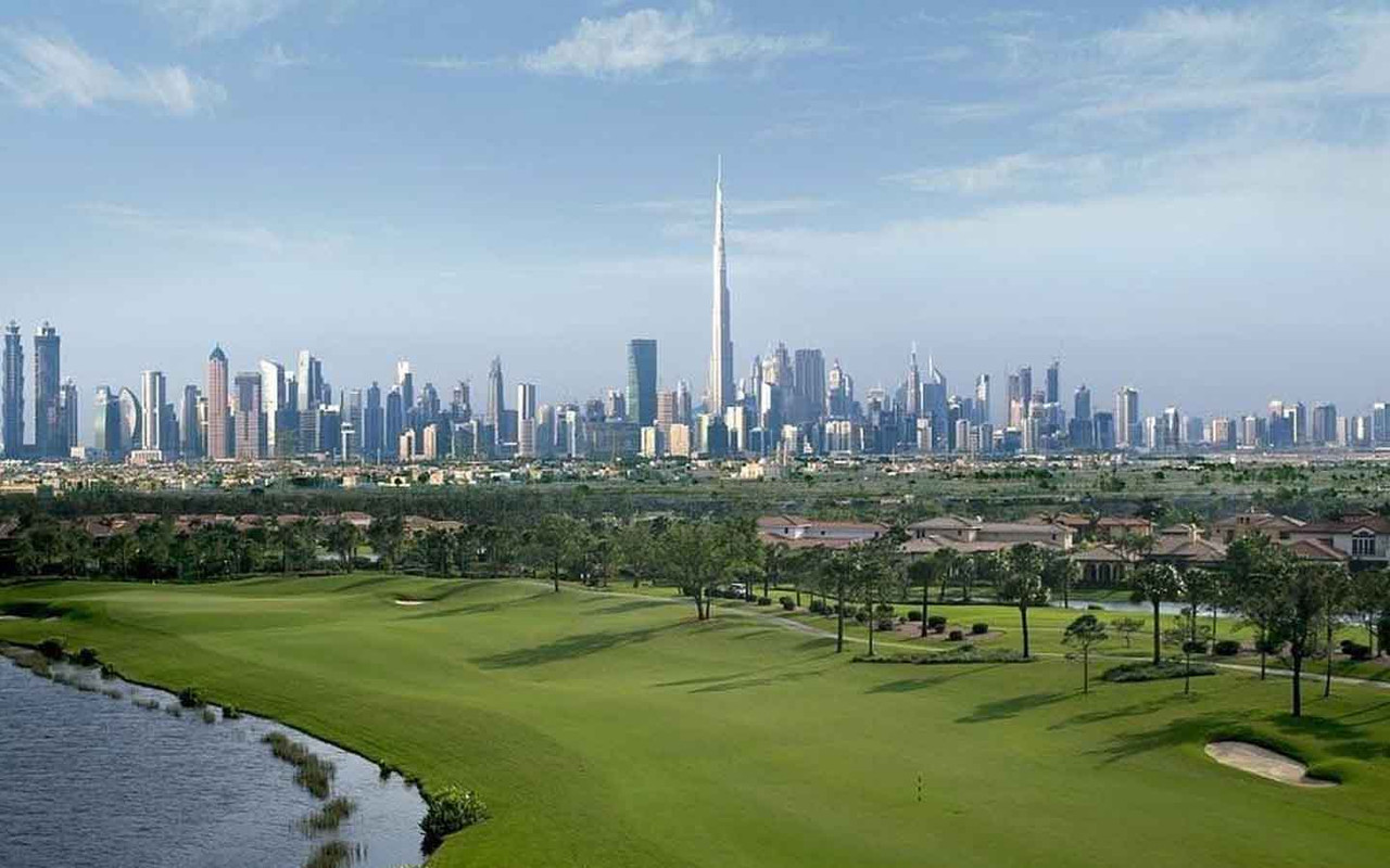 A image of Dubai Hills with the Burj Khalifa in the background in the early morning