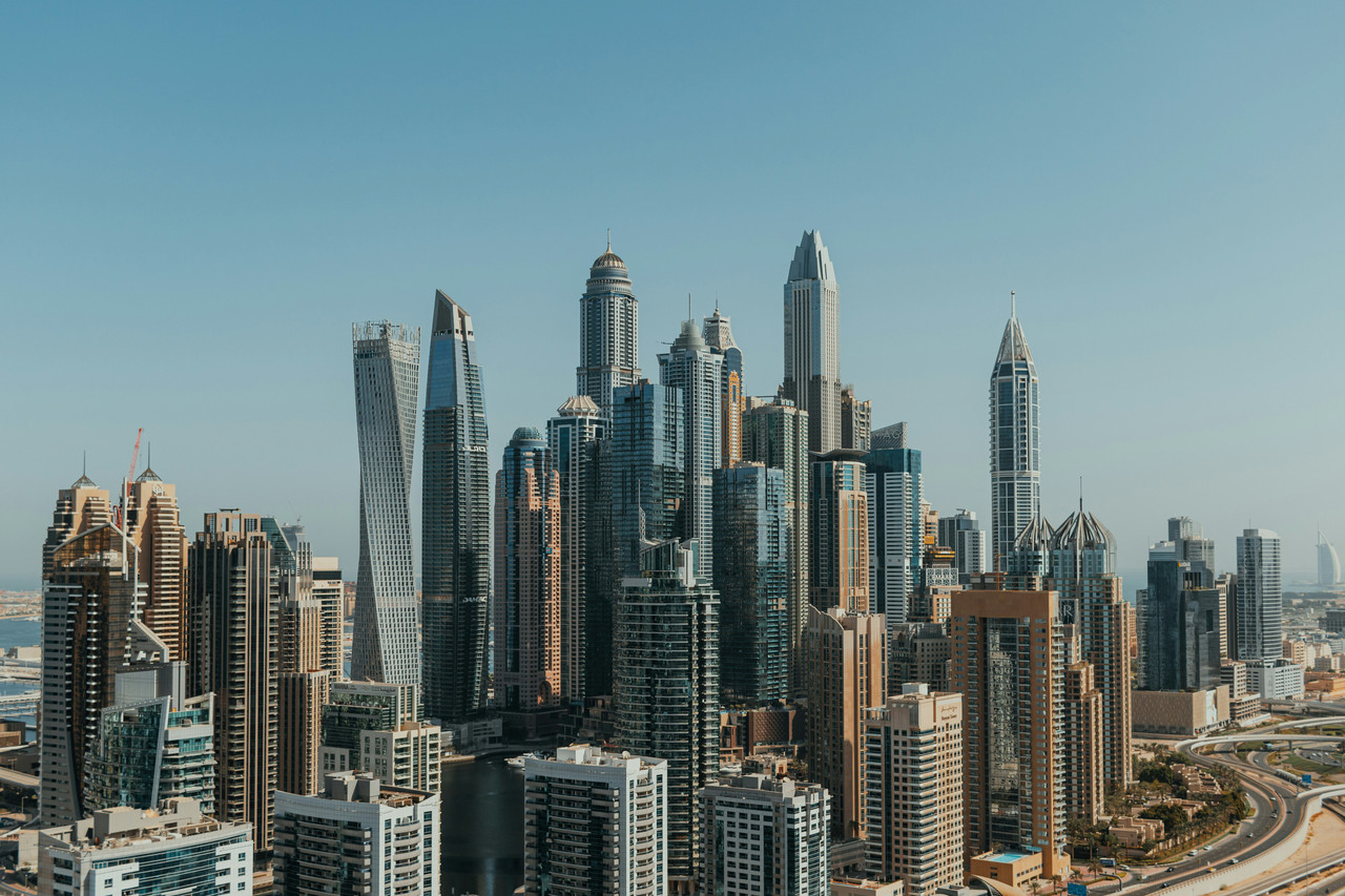 An image of Dubi Marina buildings including the famous Cayan Tower on a summers day.