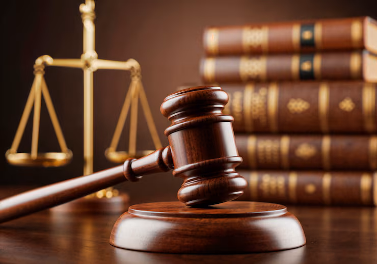 Gavel and model houses representing Dubai's shared housing law enforcement