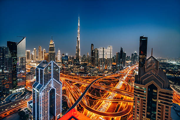 Dubai skyline at night with Burj Khalifa, representing areas that clear the new AED 2 million Golden Visa threshold